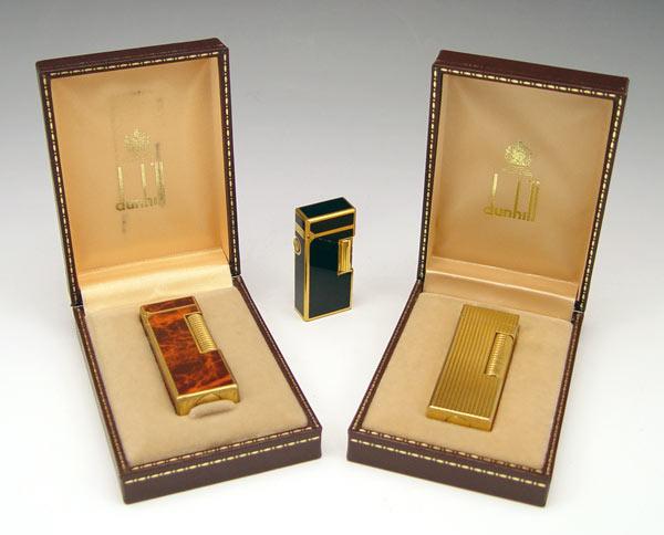 Appraisal: PIECE DUNHILL ROLLAGAS LIGHTERS To include Burl wood lacquer case