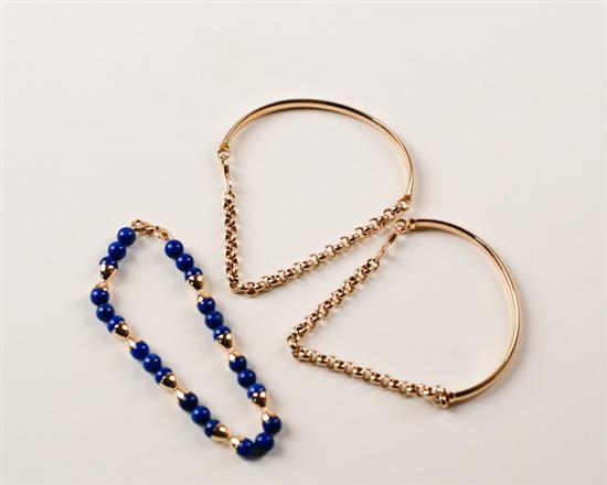 Appraisal: Three Gold Bracelets two of half hoops and chains of