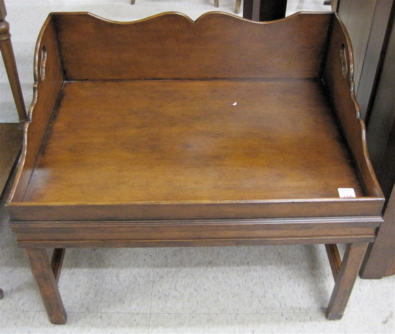 Appraisal: BUTLER'S TRAY-TOP COFFEE TABLE Chippendale Revival style American th century