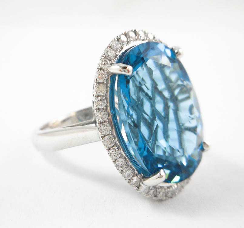 Appraisal: BLUE TOPAZ DIAMOND AND FOURTEEN KARAT GOLD RING The white