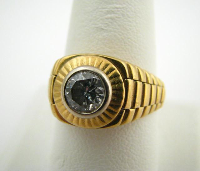 Appraisal: Gents K yellow gold Rolex-style ring with one round diamond