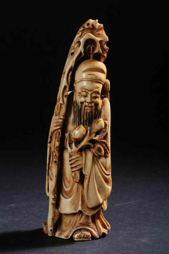 Appraisal: CHINESE IVORY FIGURE OF IMMORTAL Ming dynasty mark Standing holding