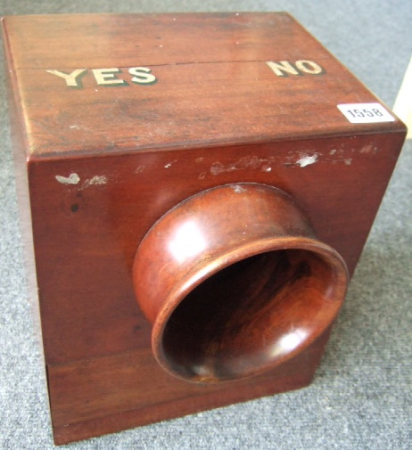 Appraisal: A Victorian mahogany ballet box with port hole type aperture