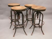 Appraisal: Four Toledo Stools Four metal stools with rotating wood seats