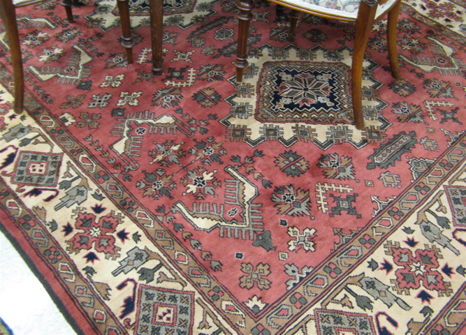 Appraisal: HAND KNOTTED AFGHANI TRIBAL CARPET three geometric medallion and stylized