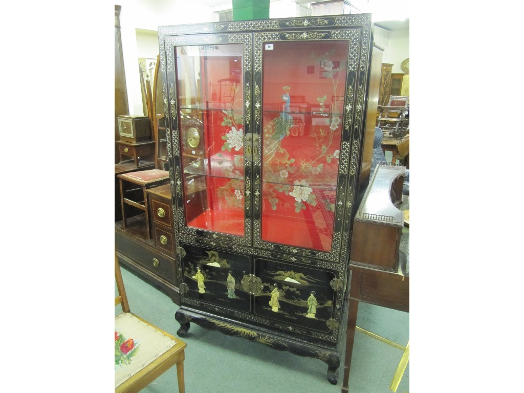 Appraisal: Chinese lacquered display cabinet decorated with Geisha figures