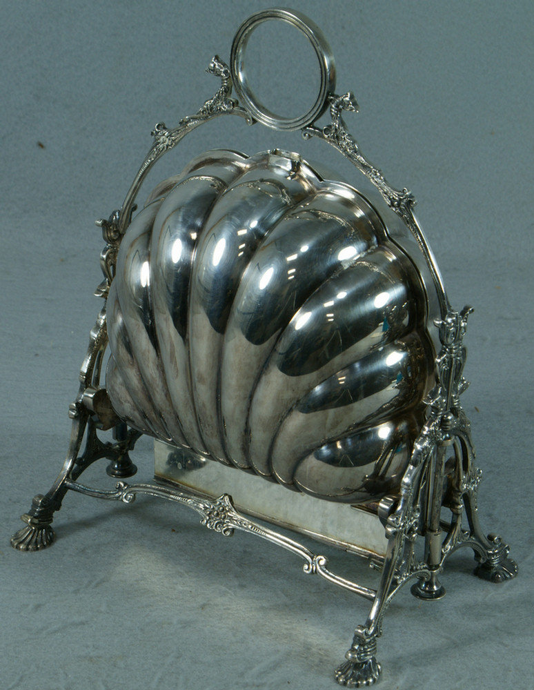 Appraisal: Sheffield plated silver clamshell toast holder griffins on handle high