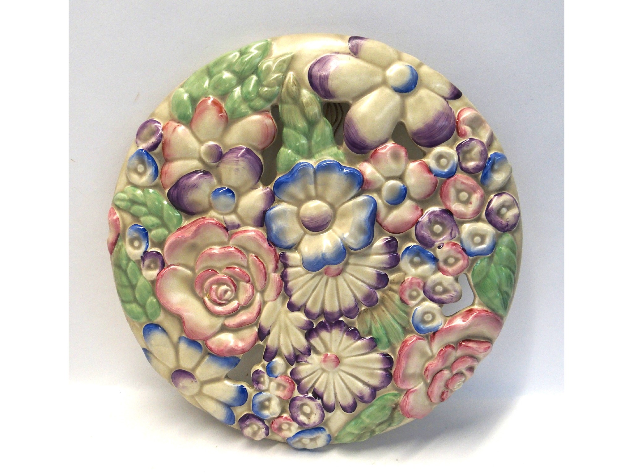 Appraisal: Clarice Cliff moulded flower wall plaque in pinks and purples