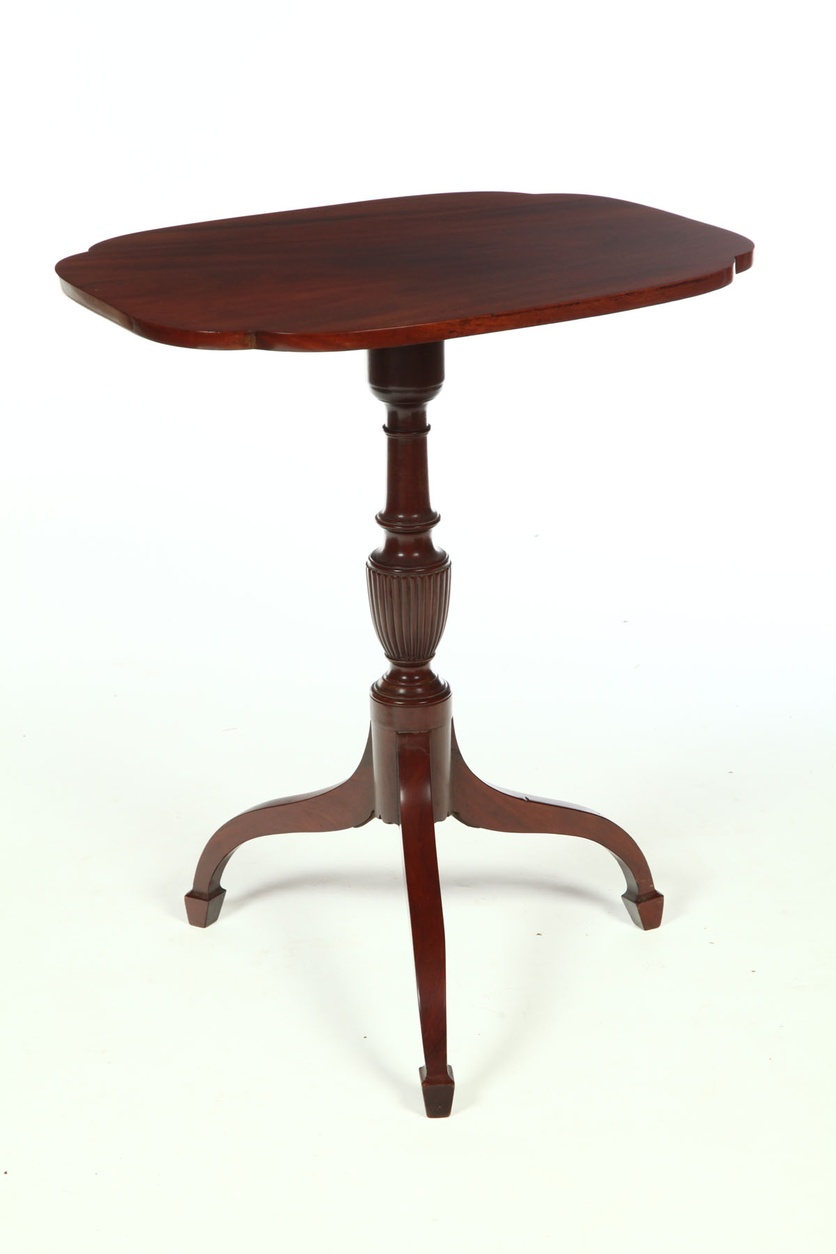 Appraisal: FEDERAL TILT-TOP CANDLESTAND American early th century mahogany Shaped top