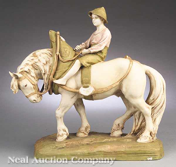 Appraisal: A Royal Dux Porcelain Figure of a Boy Riding a