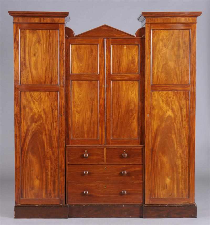 Appraisal: SCOTTISH REGENCY MAHOGANY WARDROBE The centerpart with pitched pediment above