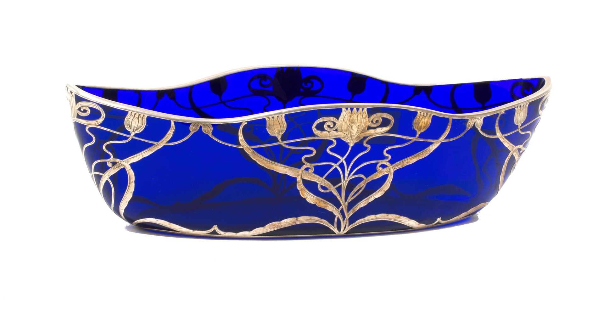 Appraisal: An Art Nouveau blue glass and silver overlay shaped bowl