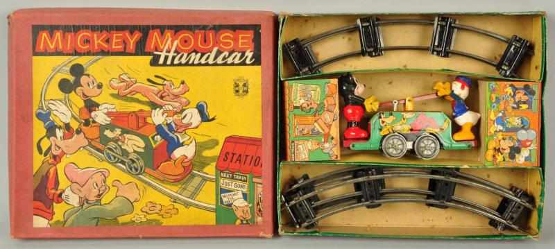 Appraisal: Tin Litho Wells Disney Mickey Handcar Wind-Up Toy Description English