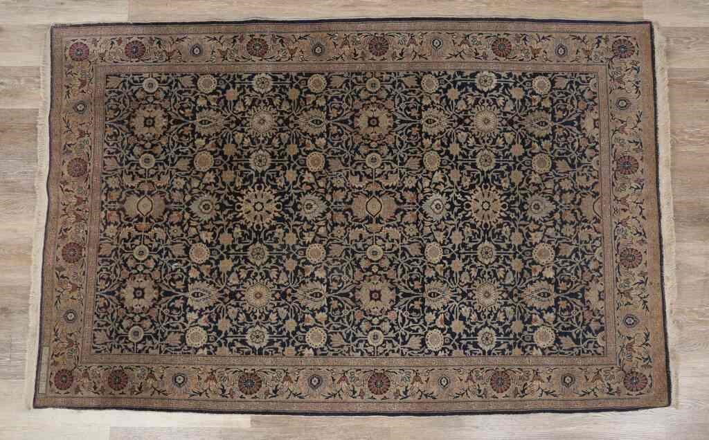 Appraisal: Persian rug th century Floral motif patterns against a dark