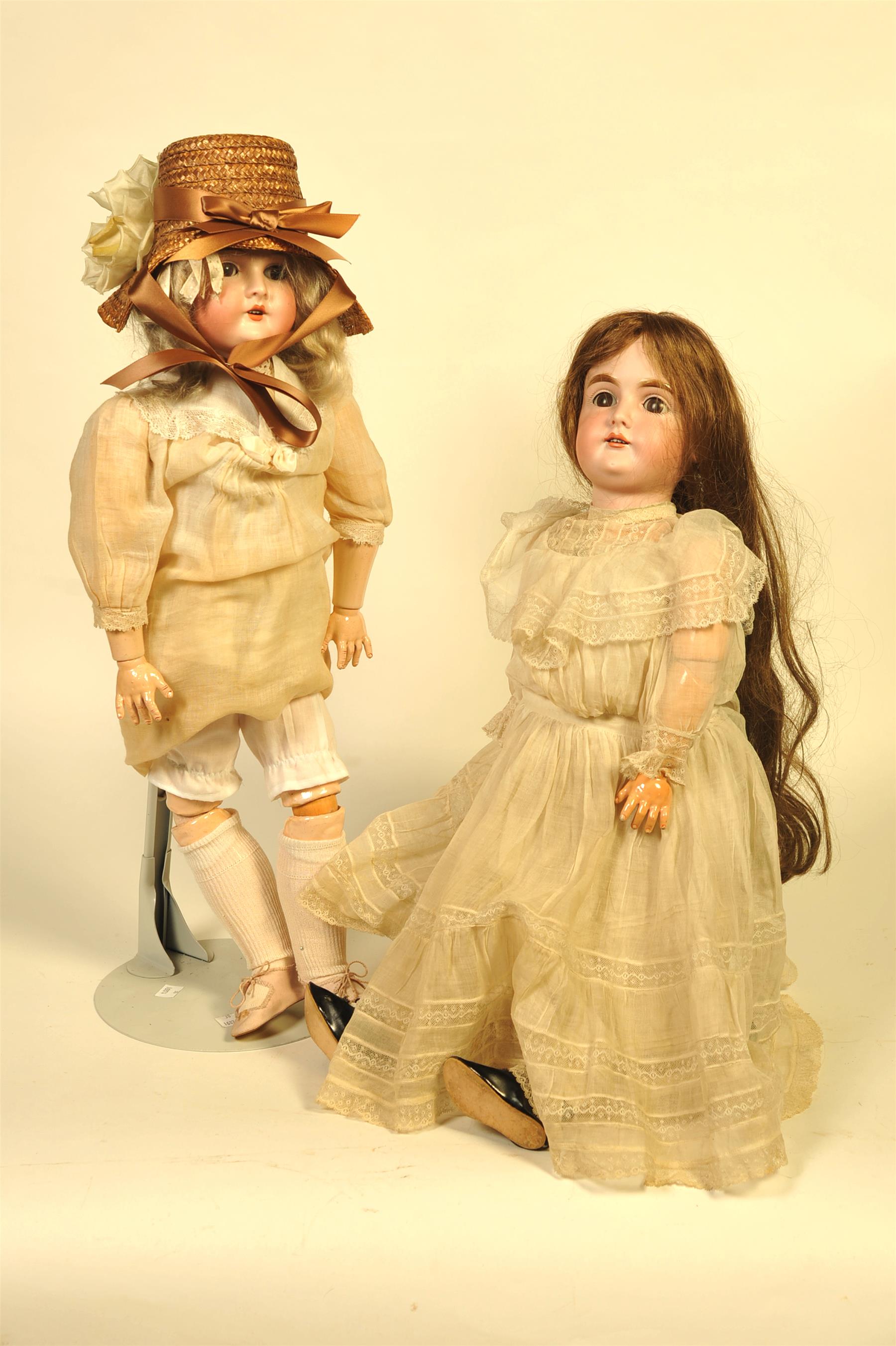 Appraisal: TWO BISQUE HEAD DOLLS Germany Queen Louise with weighted eye