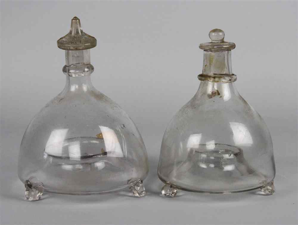 Appraisal: TWO GLASS FLY-CATCHERS th century of bottle form with collared