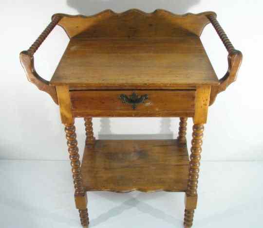 Appraisal: A Sheraton style spool turned washstand with carved backsplash one