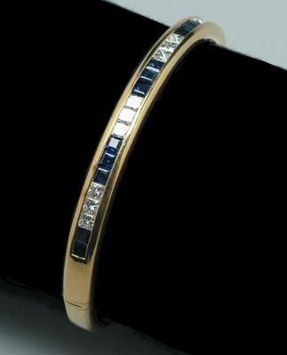 Appraisal: Sapphire and diamond bracelet alternating bands of princess cut diamonds