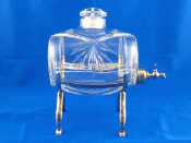 Appraisal: A cut glass whisky barrel with plated tap and stand