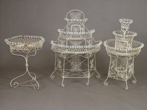 Appraisal: A collection of five white painted wirework garden planters of