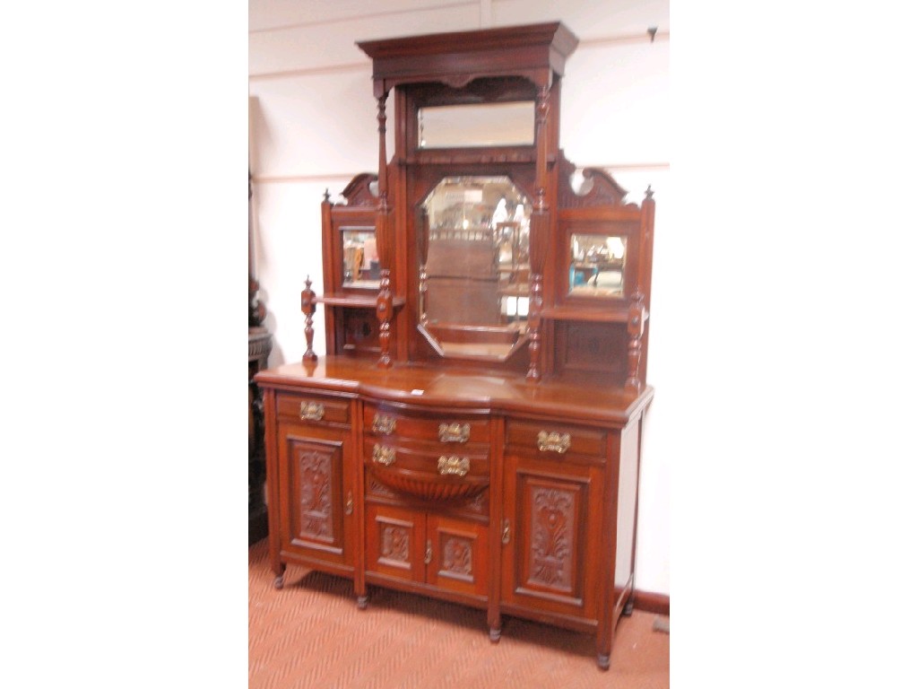 Appraisal: A late Victorian walnut mirror back sideboard with shelved and