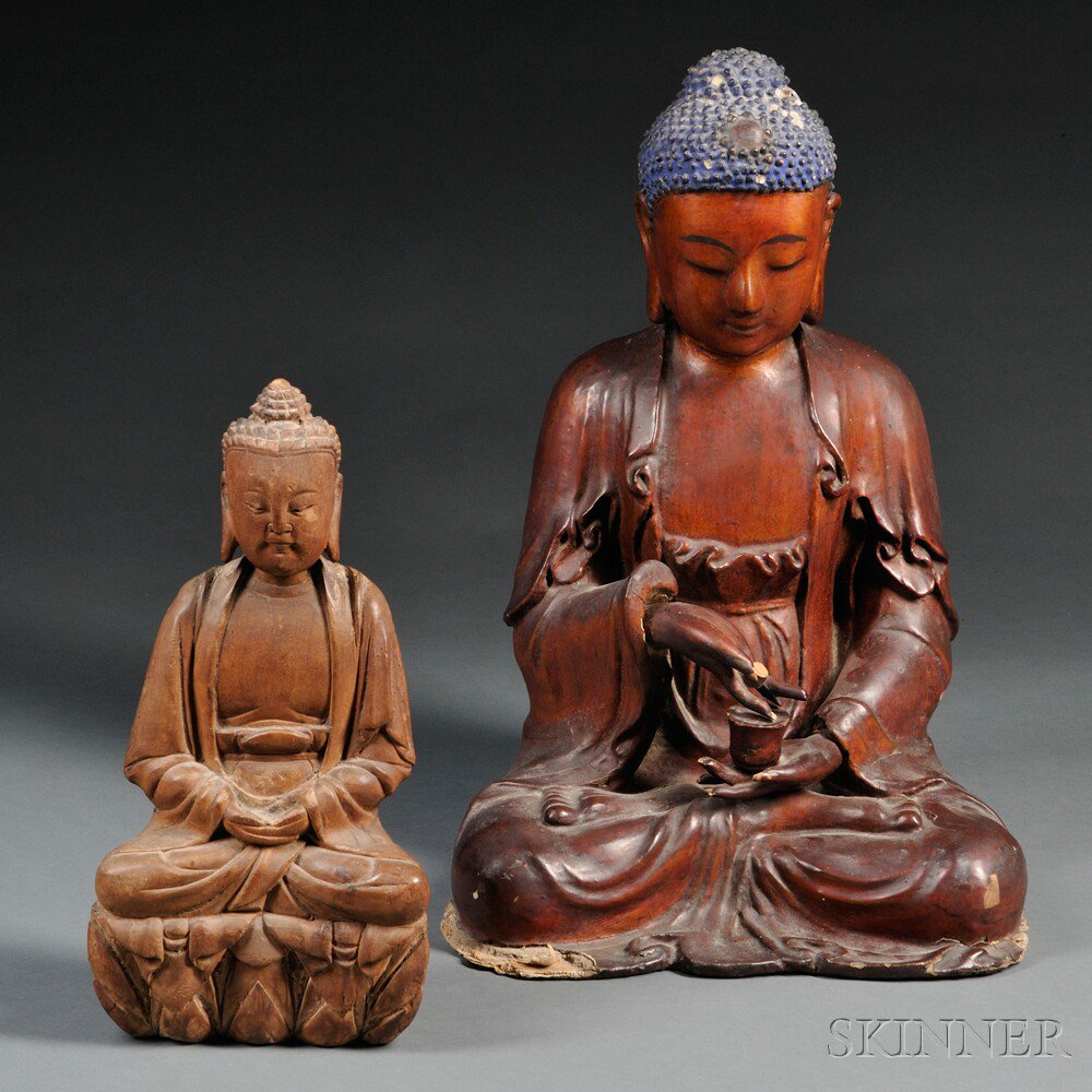 Appraisal: Two Carved Wood Seated Figures of Buddha Asia one seated