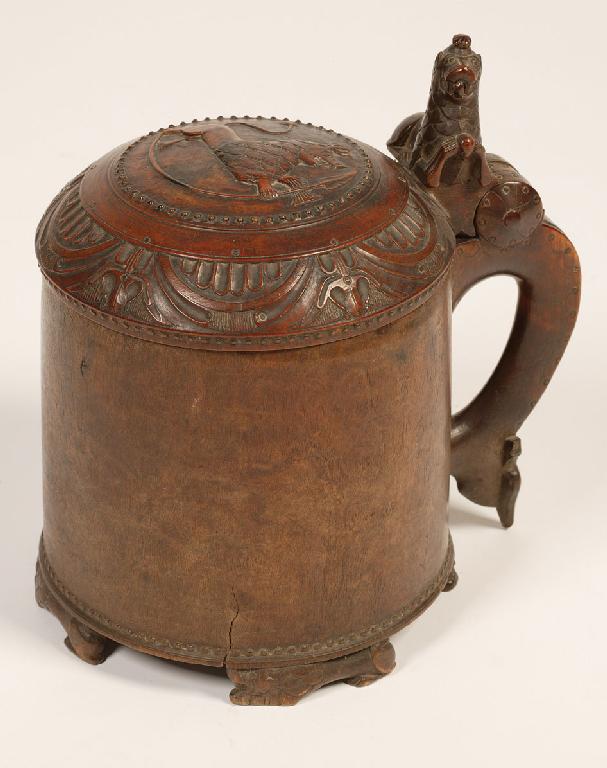 Appraisal: A NORWEGIAN TREEN PEG TANKARD the domed lid carved with