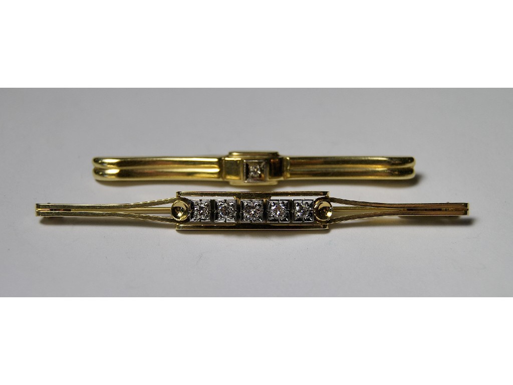 Appraisal: Yellow and white gold bar brooch set five brilliant cut