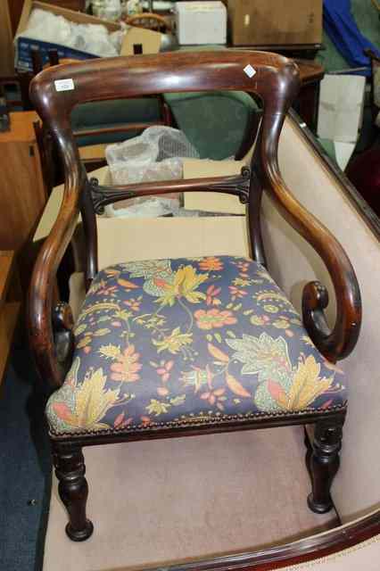 Appraisal: A REGENCY MAHOGANY ELBOW CHAIR with shaped cresting rail over