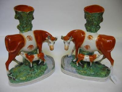 Appraisal: A PAIR OF STAFFORDSHIRE POTTERY SPILL VASES late th century