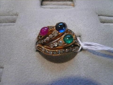 Appraisal: SNAKE RING SAPPHIRE EMERALD RUBY AND DIAMONDS GOLD AND PLATINUM