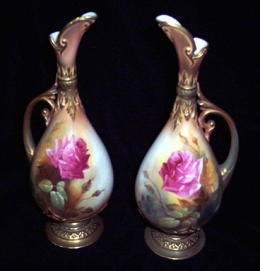 Appraisal: A pair of Royal Worcester ewers of teardrop shape with