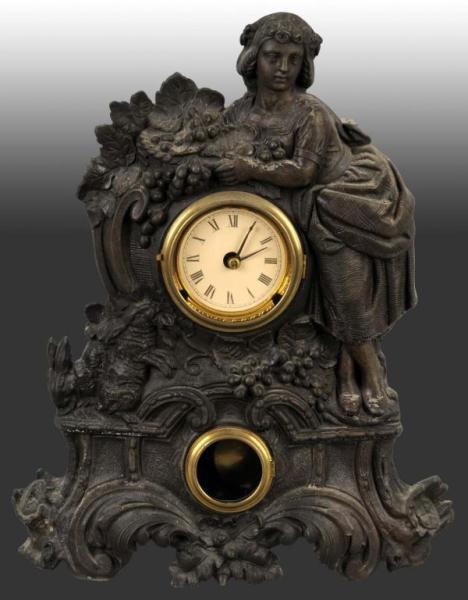 Appraisal: Metal Time Strike Clock with Woman Rabbits Description August Ramrough