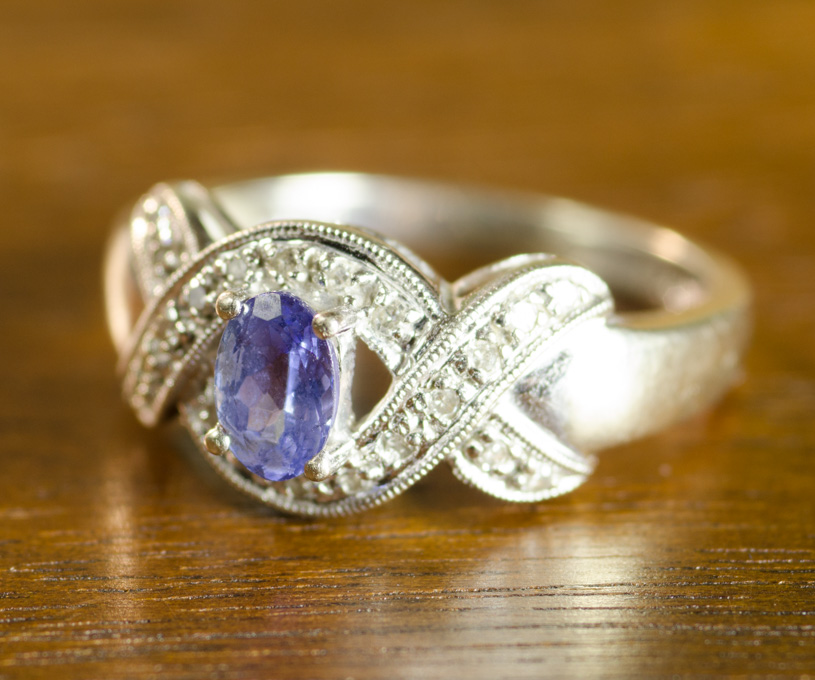 Appraisal: TANZANITE DIAMOND AND FOURTEEN KARAT GOLD RING with round-cut diamonds