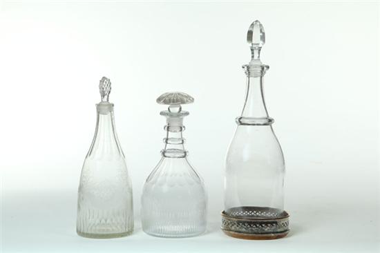 Appraisal: THREE DECANTERS AND A WINE COASTER Probably American th century