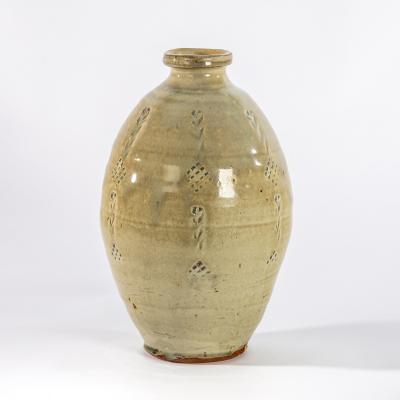 Appraisal: Mike Dodd British born a celadon glaze bottle vase with