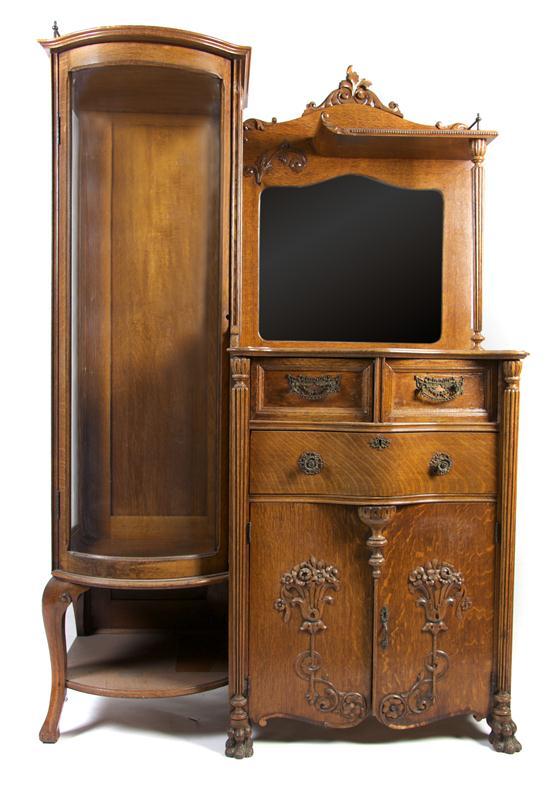 Appraisal: An American Victorian Oak Side-by-Side having a rounded vitrine door