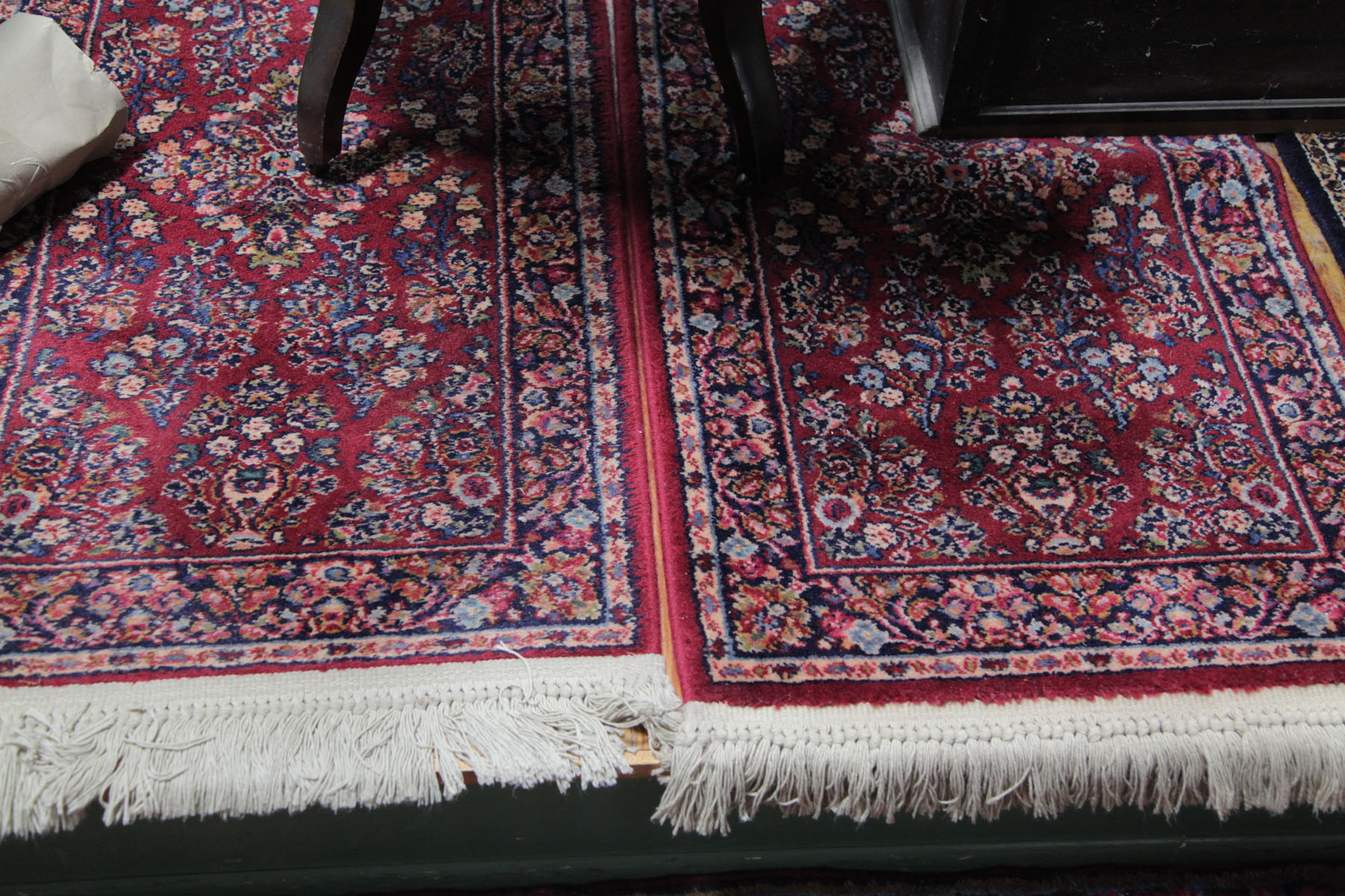 Appraisal: PAIR OF ORIENTAL STYLE MATS American th century Maroon fields