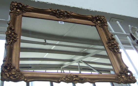 Appraisal: A th century gilt framed wall mirror moulded with floral