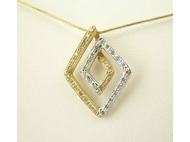 Appraisal: K two tone yellow and white gold diamond pendant in