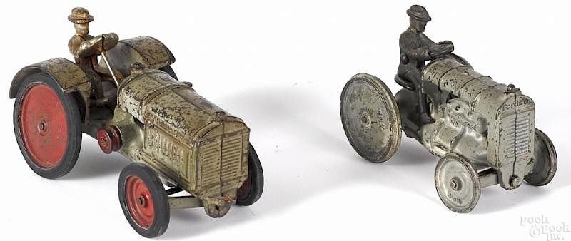 Appraisal: Two Arcade cast iron tractors Two Arcade cast iron tractors