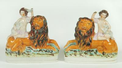 Appraisal: A PAIR OF STAFFORDSHIRE POTTERY FIGURES th century modelled as