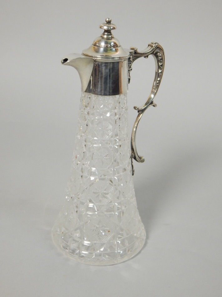 Appraisal: An Edwardian cut glass and silver mounted claret jug the