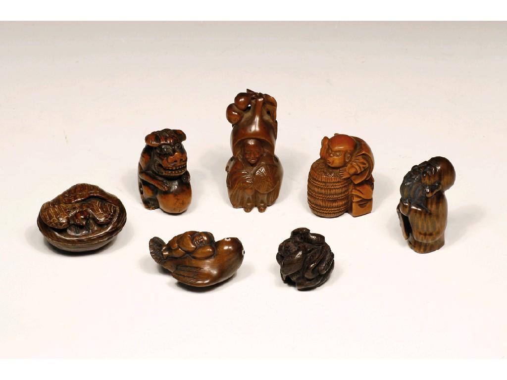 Appraisal: SEVEN JAPANESE CARVED WOOD NETSUKES three of figures the other