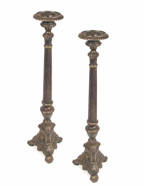 Appraisal: A pair of cast iron floor altar sticks height ft