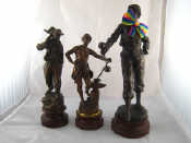 Appraisal: Three spelter figures An early th century Terrassier labourer on