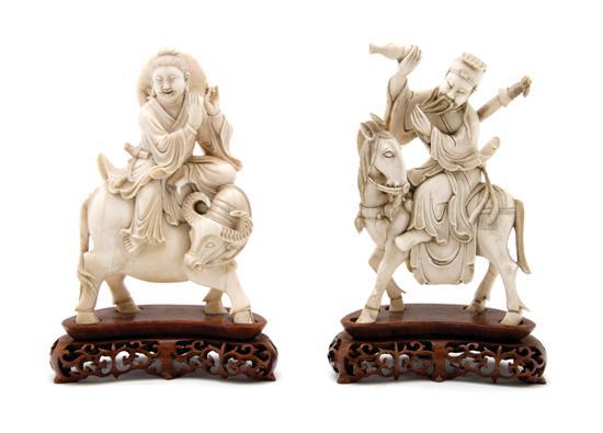 Appraisal: Pair of Asian Ivory Figures of Immortals one riding a