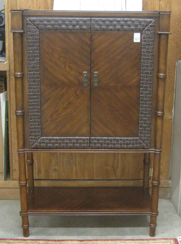 Appraisal: A MODERN TWO-DOOR CABINET ON STAND the doors opening to