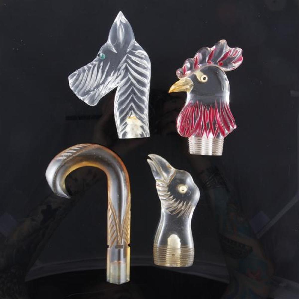 Appraisal: FOUR LUCITE UMBRELLA CANE HANDLES RARE CARVED PAINTED ROOSTER S-