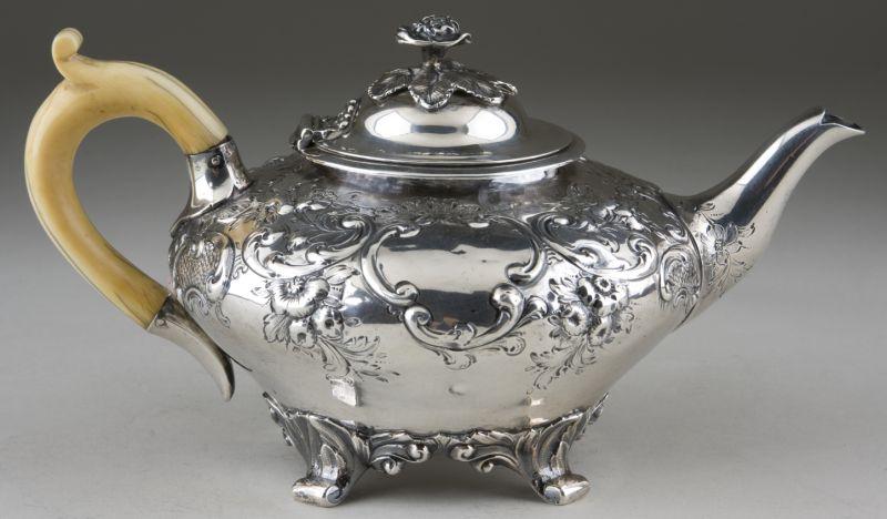 Appraisal: Victorian Sterling Teapot by Henry Holland of compressed globular form